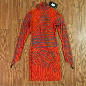 Orange bodycon dress with prints.